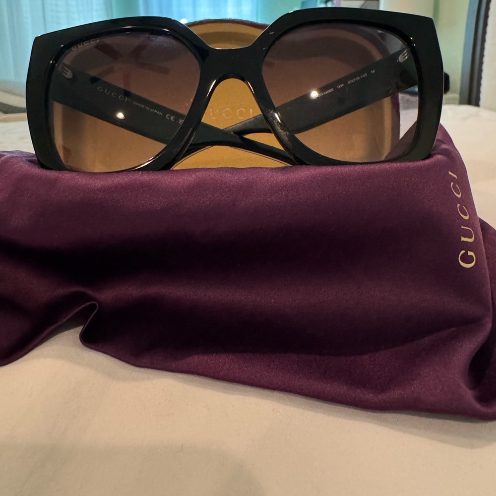 Gucci Black Sunglasses with sporty white stripe on arms